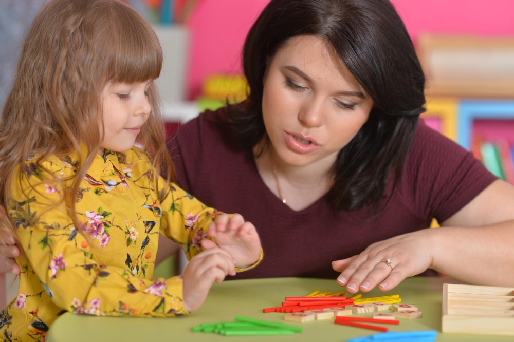 Engaging Learning Moment Between Mother And Daughter